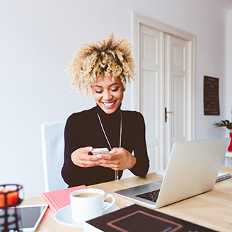 woman_on_phone_and_laptop_square_328x328_flip